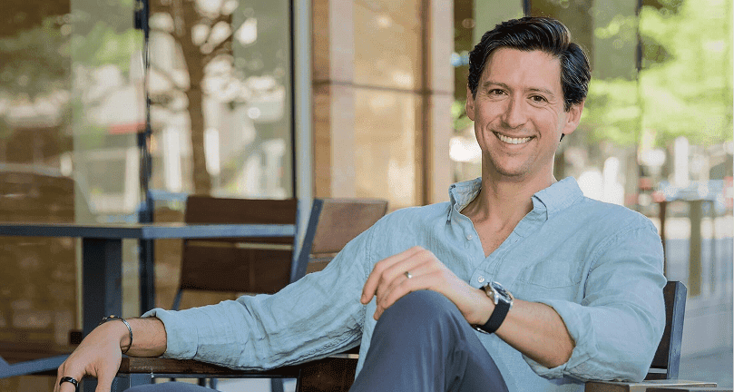 Ryan Williamson M.D. sitting on a chair, in a relaxed position, smiling